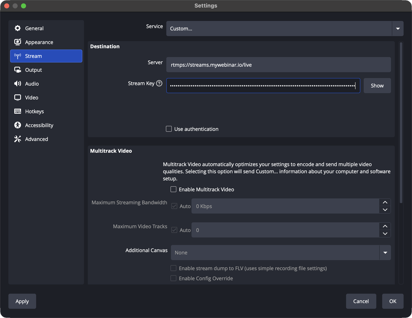 The Stream page of the OBS Studio settings with Service set to Custom, the Server field filled in and the Stream Key hidden behind dots