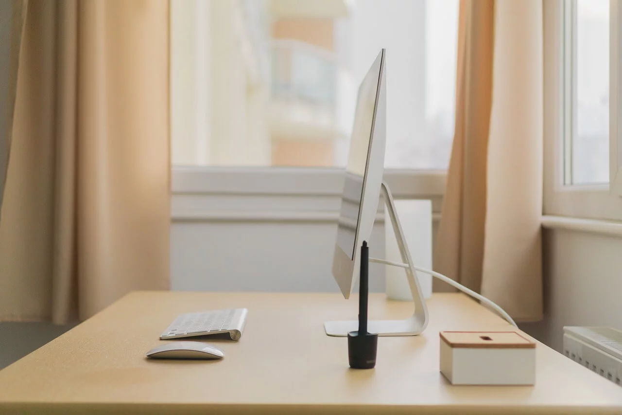 Webinar equipment setup including camera, microphone, and lighting on a desk