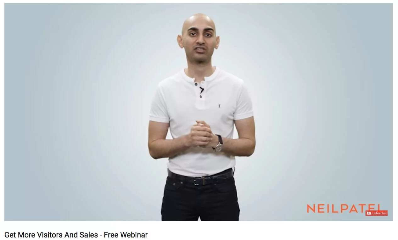 A video still of a presenter standing beside the caption Get more visitors and sales, free webinar
