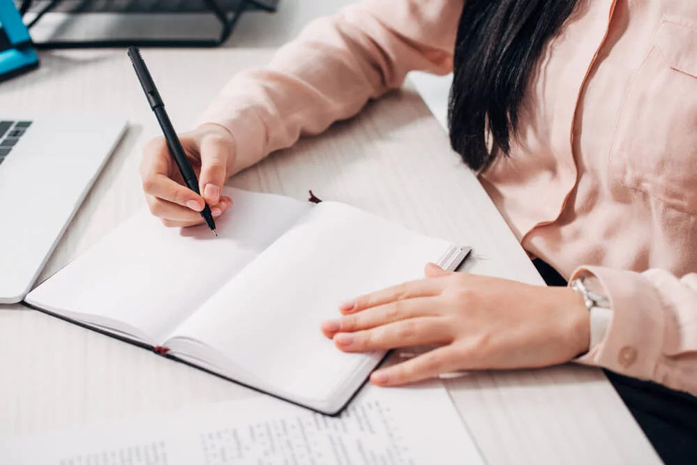 Digital notebook and coffee on a desk