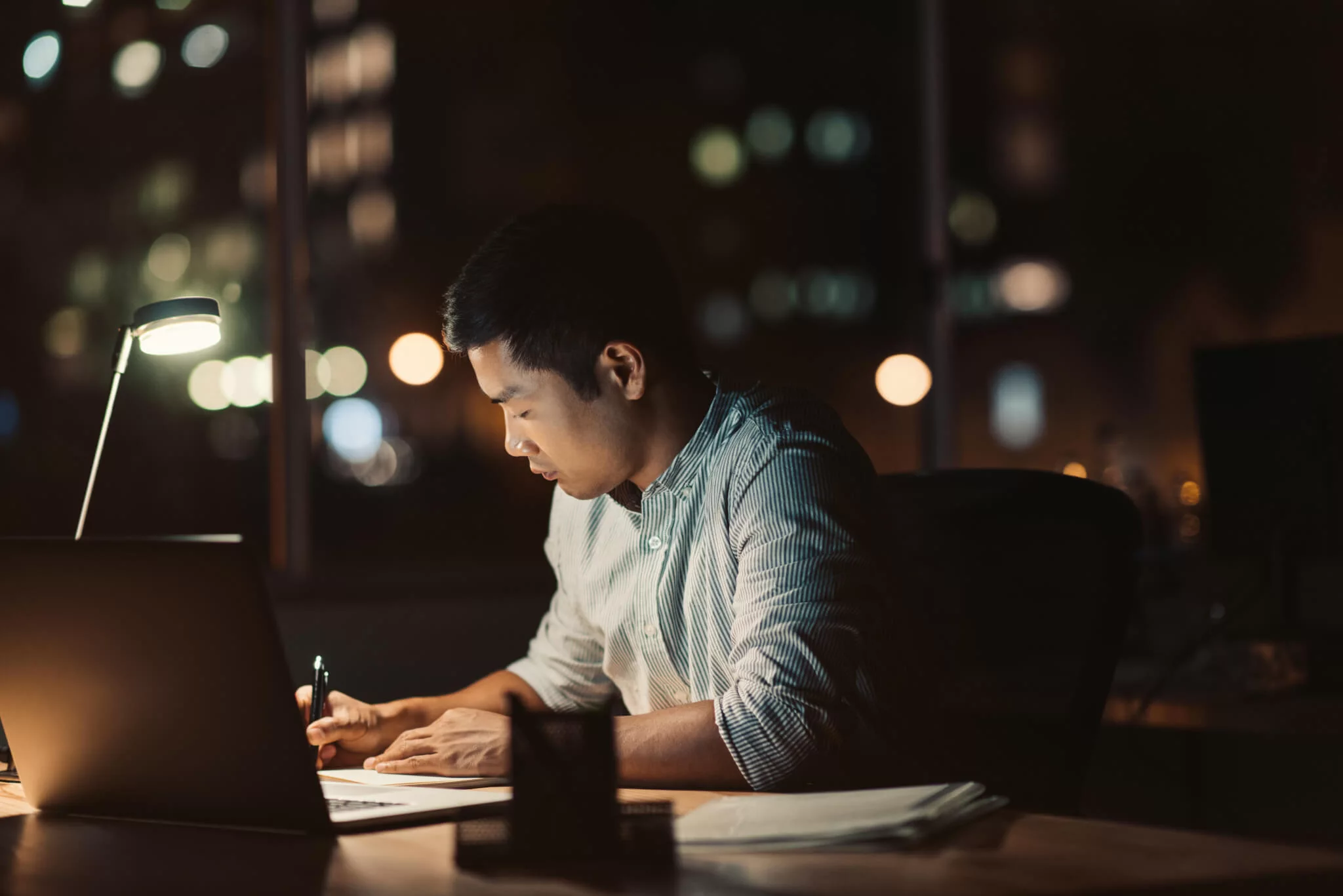 A student attending a webinar from a cozy home setting