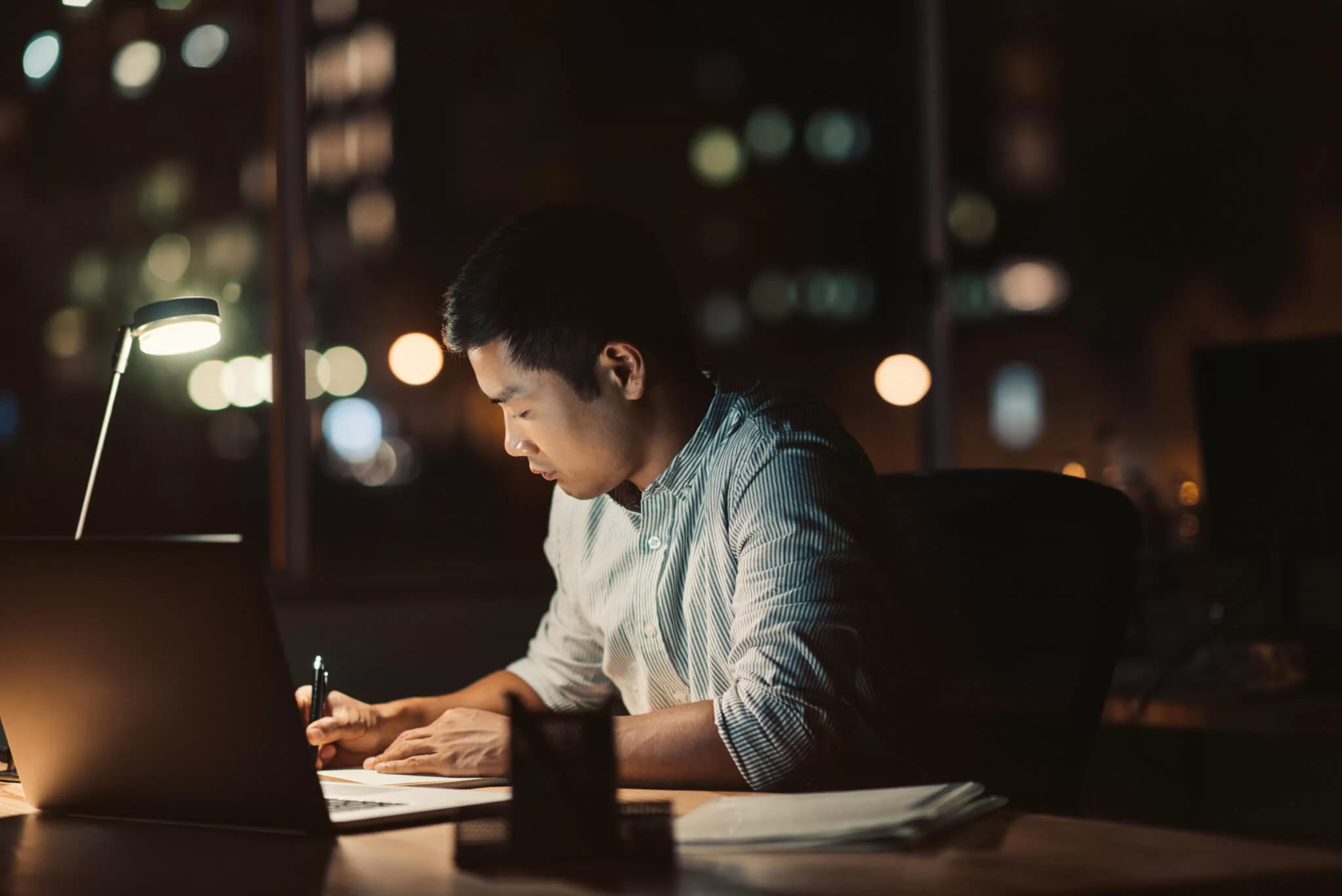 A student attending a webinar from a cozy home setting